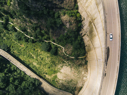 Birds eye view of green land and road