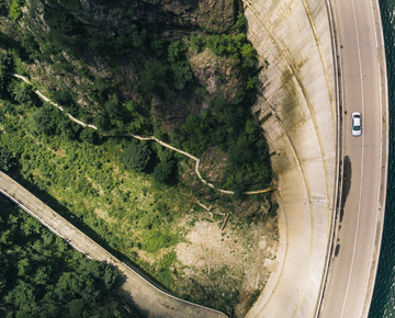 Birds eye view of green land and road