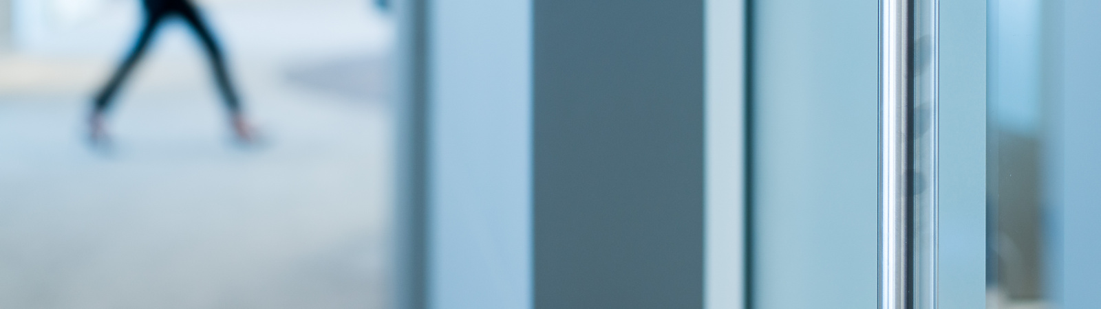 person walking through work building
