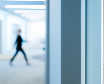 person walking through work building