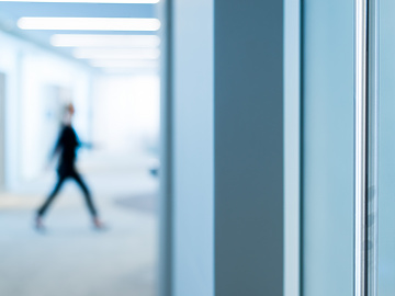 person walking through work building