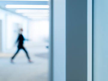 person walking through work building