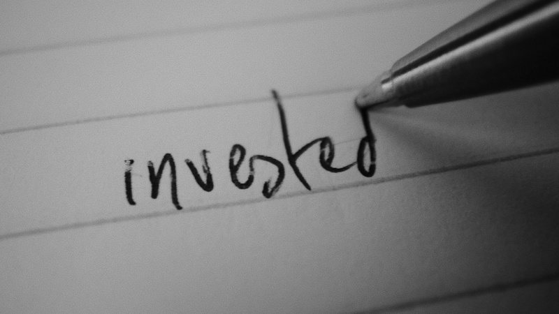 a close-up of a pen writing on a piece of paper