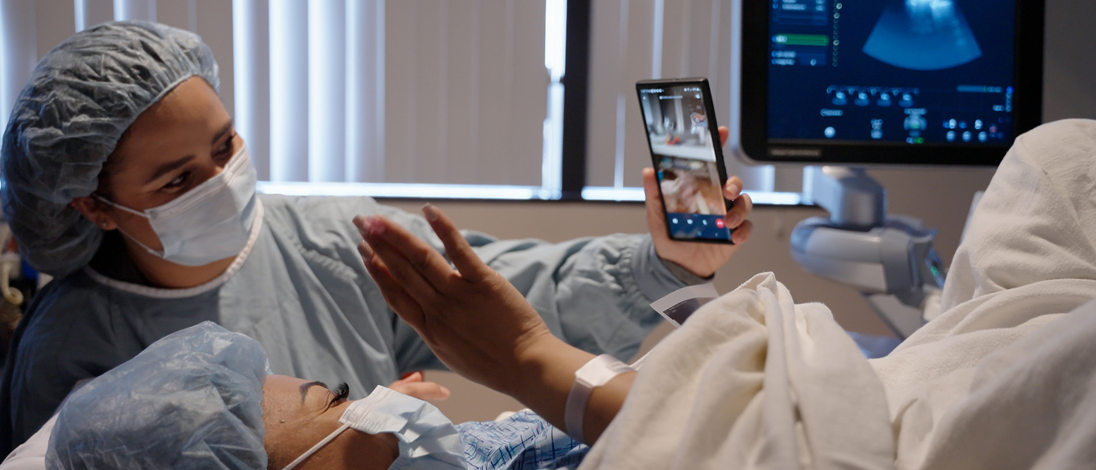 Surrogate in hospital bed on facetime