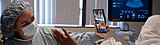 Surrogate in hospital bed on facetime