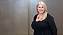 a person in black dress smiling