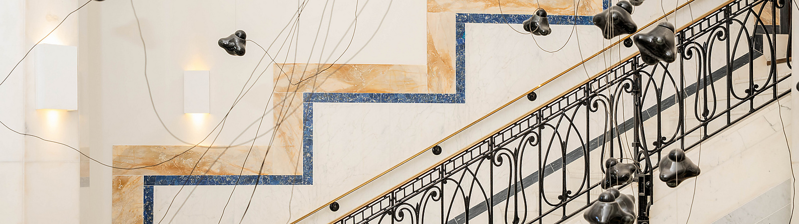 a staircase with black objects from it