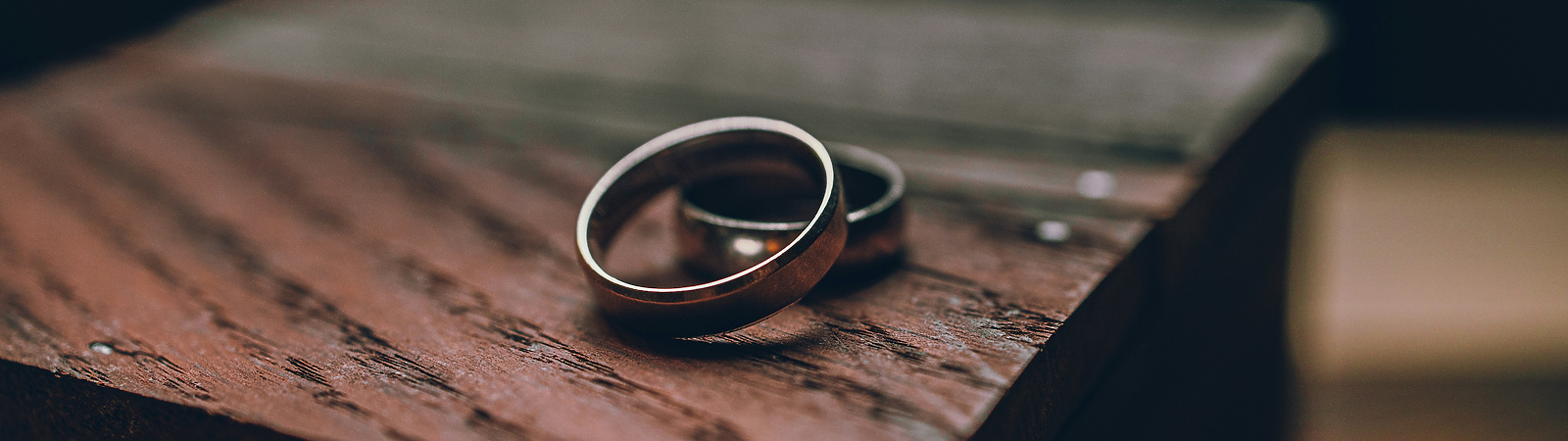 a pair of rings on a wood surface