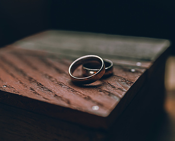 a pair of rings on a wood surface