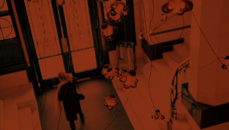 a group of lights from a ceiling