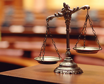 a scale of justice on a table