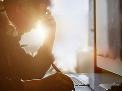 Shot of stressed man using digital graphic tablet while working at modern office