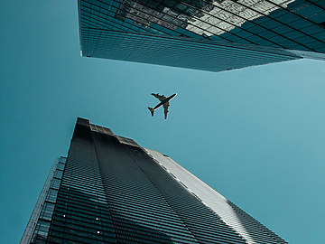 low-angle photography of buildings under clear blue sky during daytime
