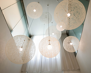 a group of white lights from the ceiling