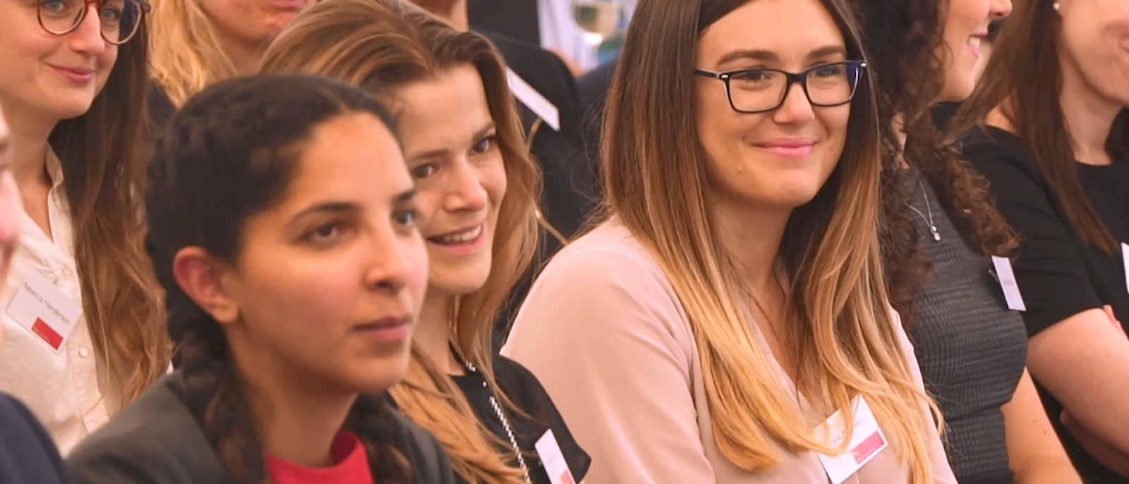 A group of people sitting together at a seminar