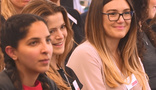 A group of people sitting together at a seminar