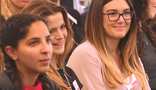 A group of people sitting together at a seminar