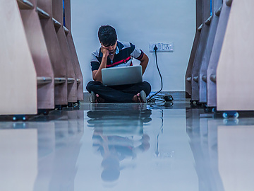Man studying in library