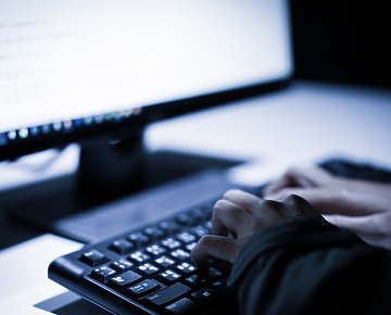 person typing on keyboard