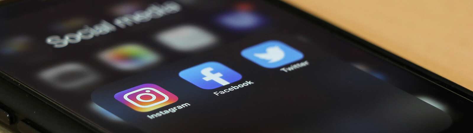 a close up of a phone with social media apps