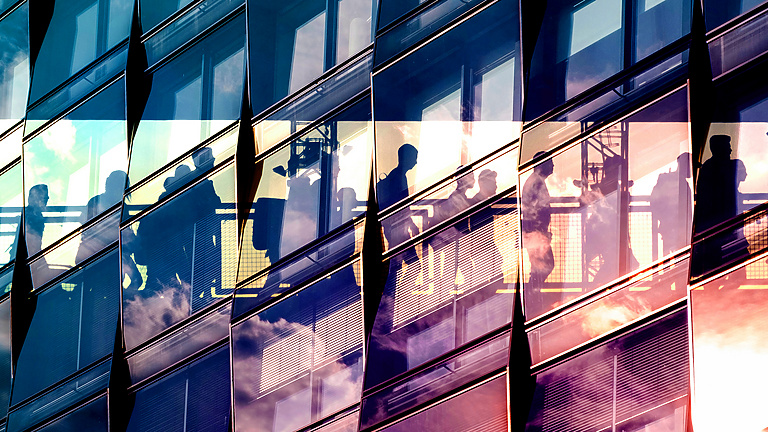 a reflection of people in a building