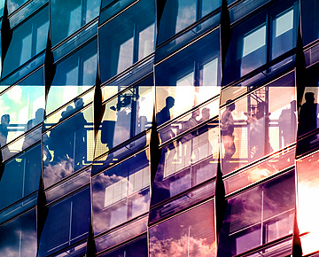 a reflection of people in a building
