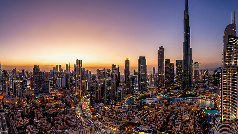 a view of Dubai at sunset