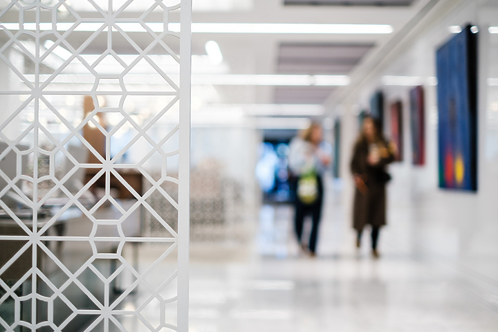 People walking through Mishcon de Reya's client lounge
