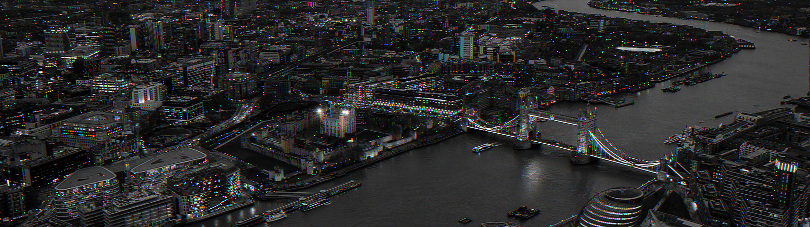 black and white view of the thames and tower bridge