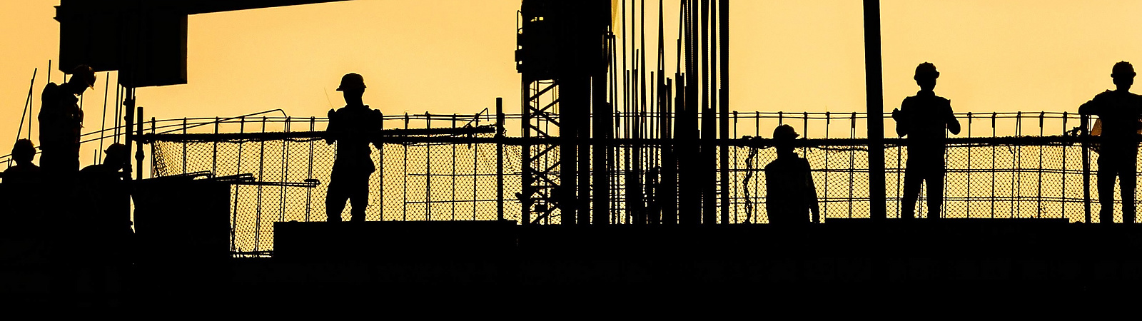 silhouette of people on a building