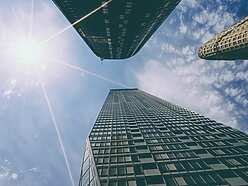 looking up view of tall buildings