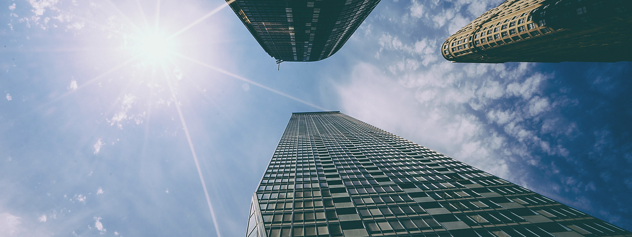 looking up view of tall buildings