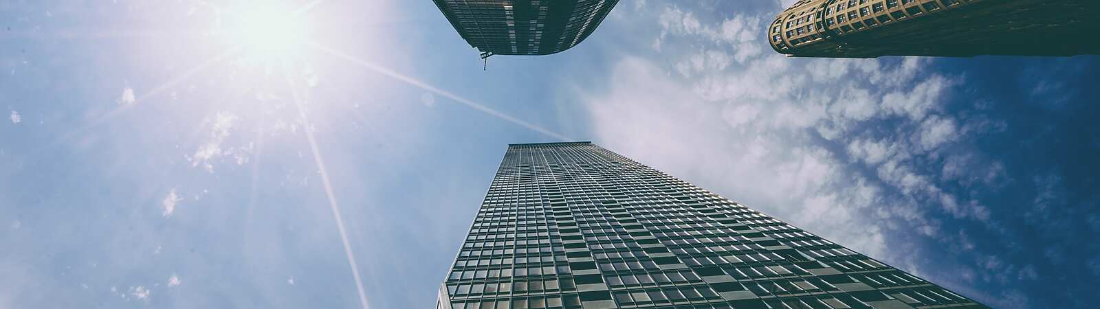 looking up view of tall buildings