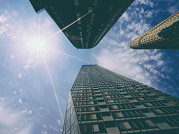 looking up view of tall buildings