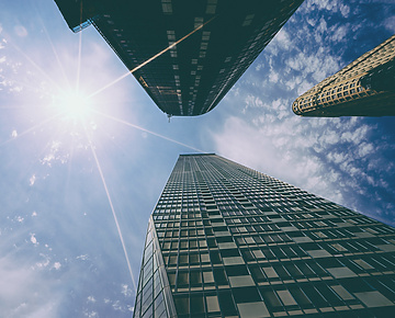looking up view of tall buildings