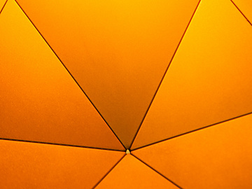 a close up view of a yellow umbrella