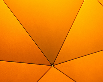 a close up view of a yellow umbrella
