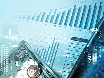 financial graph with office equipment on top