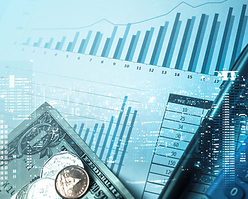 financial graph with office equipment on top