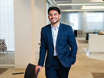 a person in a suit holding a suitcase