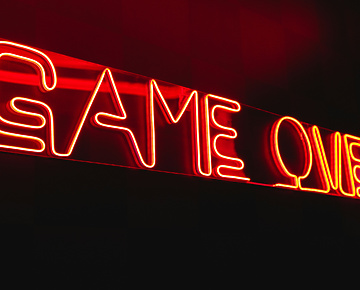 Neon light that says game on