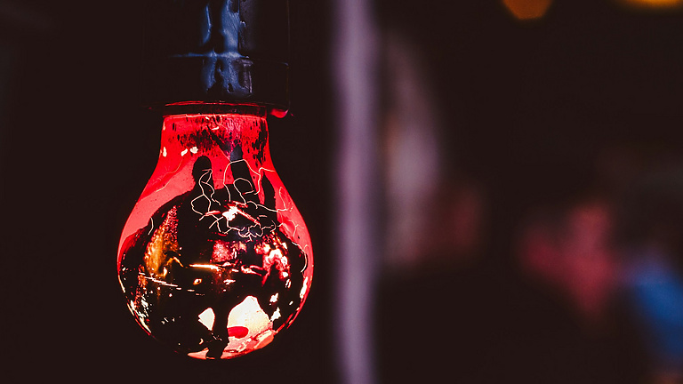 a light bulb with a red light inside