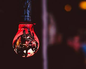 a light bulb with a red light inside