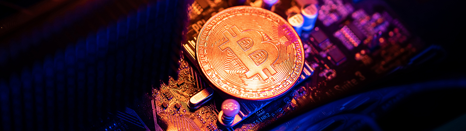 Bitcoin Cryptocurrency coin on a PC computer motherboard, crypto currency mining concept