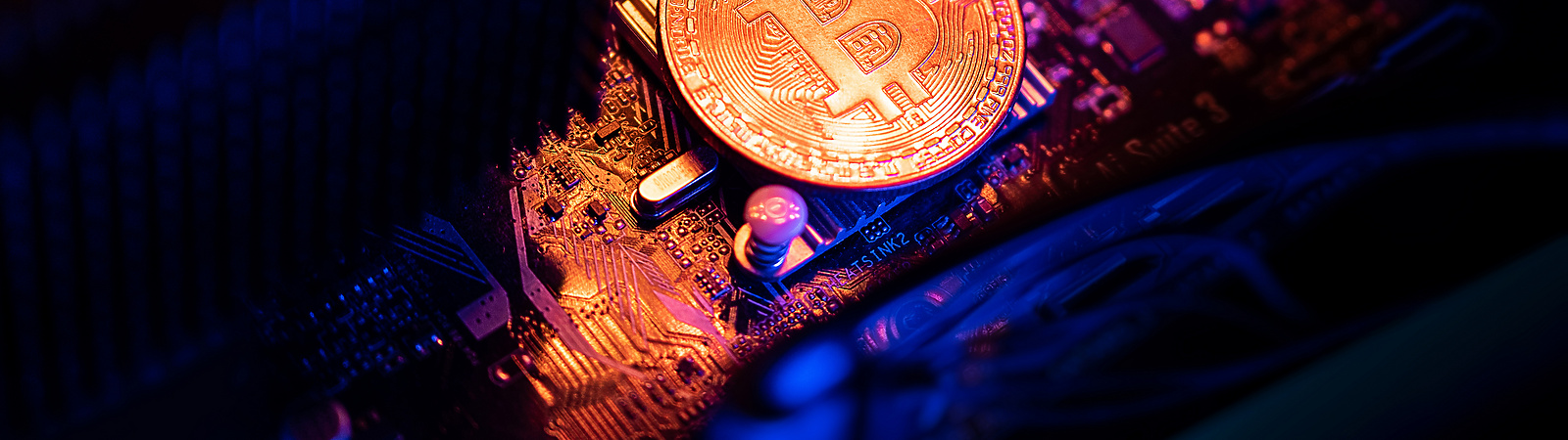 Bitcoin Cryptocurrency coin on a PC computer motherboard, crypto currency mining concept