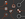 a black background with white circles and red circles with icons
