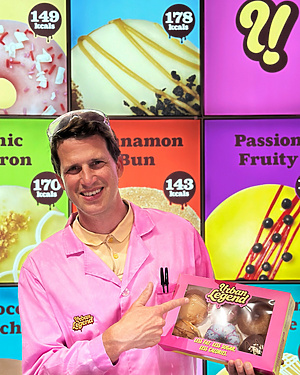 a person in pink coat holding a box of food