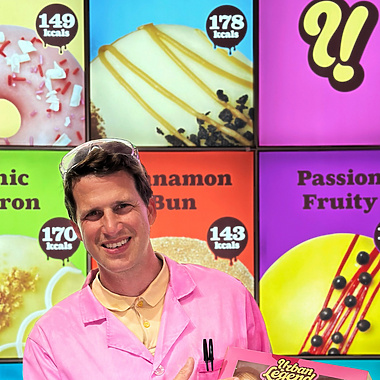 a person in pink coat holding a box of food