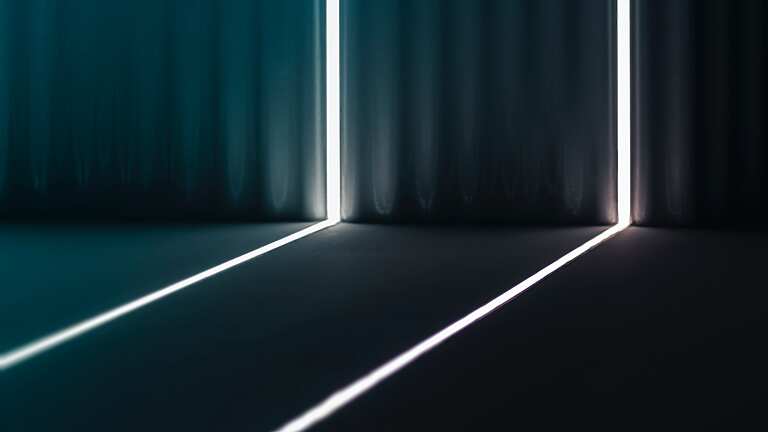 white and green light in a dark room