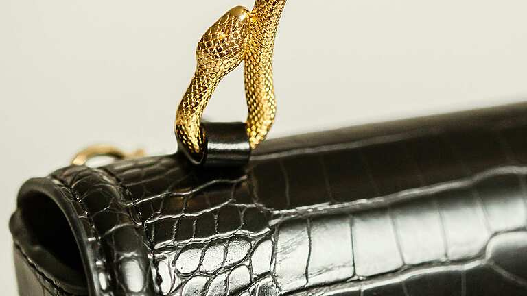 a close up of a black purse